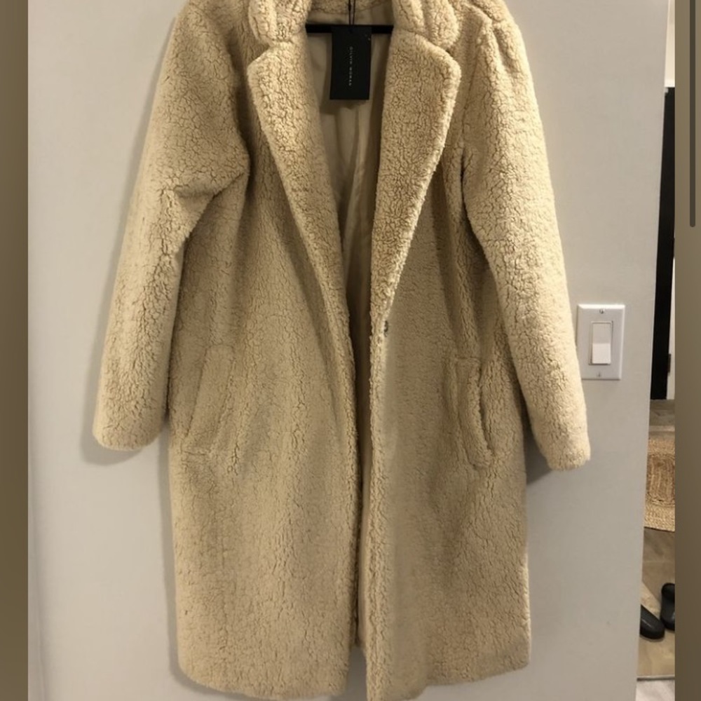 Brand new, tag on it, plush coat.